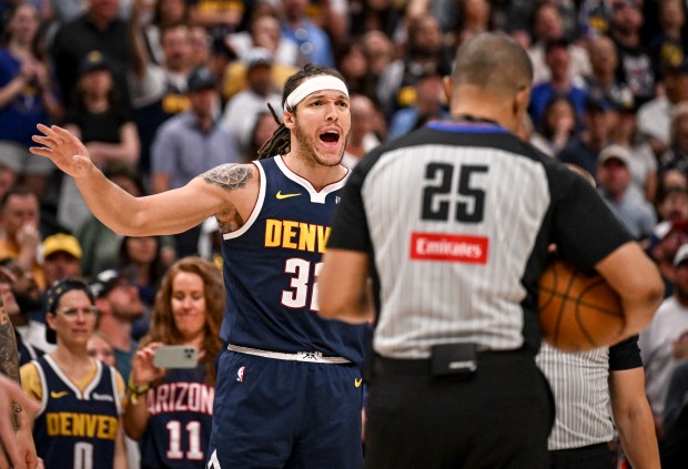 Aaron Gordon (32) of the Denver Nuggets disputes a foul...