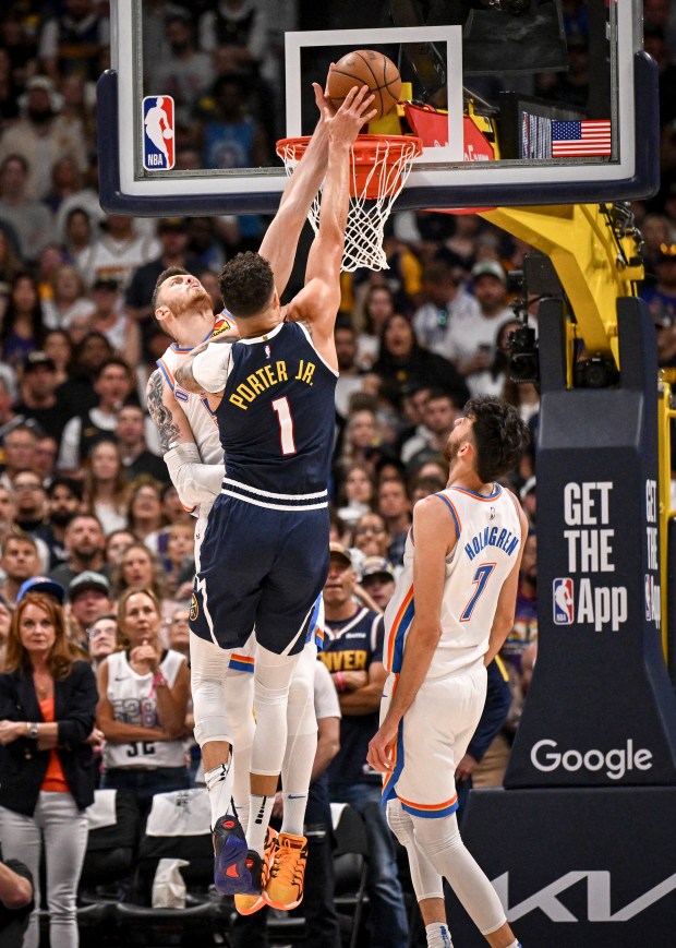 Isaiah Hartenstein (55) of the Oklahoma City Thunder blocks Michael...