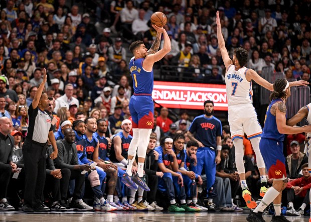 Michael Porter Jr. (1) of the Denver Nuggets knocks down...