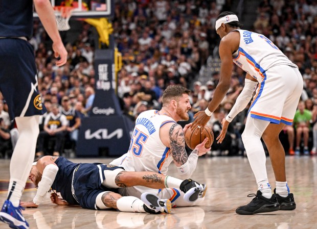Isaiah Hartenstein (55) of the Oklahoma City Thunder takes out...
