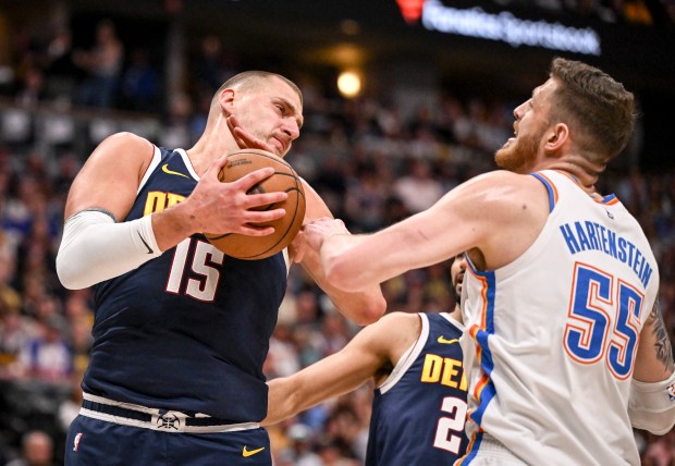 Nikola Jokic (15) of the Denver Nuggets grabs a rebound...