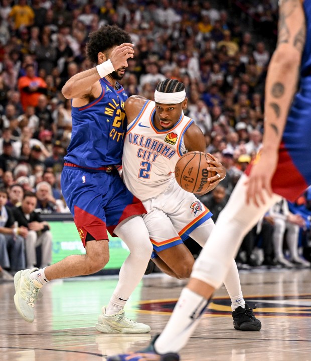 Shai Gilgeous-Alexander (2) of the Oklahoma City Thunder drives on...