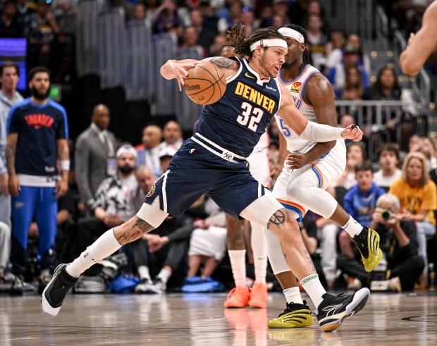 Luguentz Dort (5) of the Oklahoma City Thunder fouls Aaron...