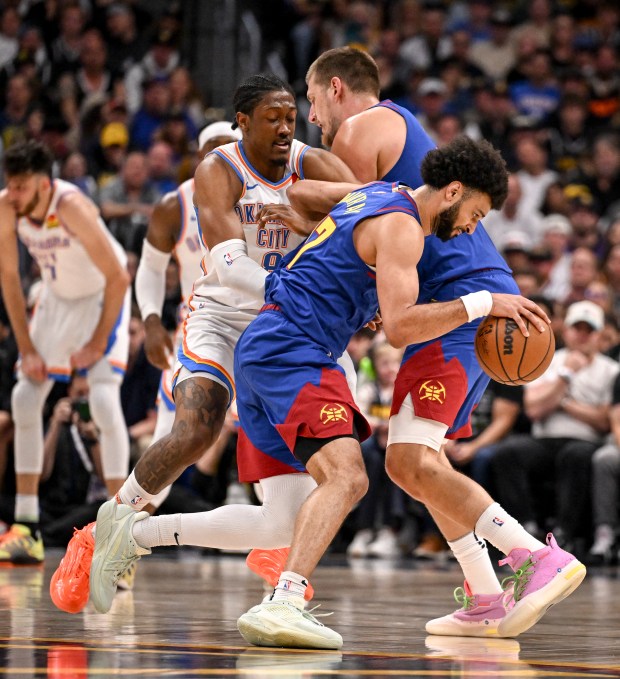 Nikola Jokic (15) of the Denver Nuggets screens Jalen Williams...