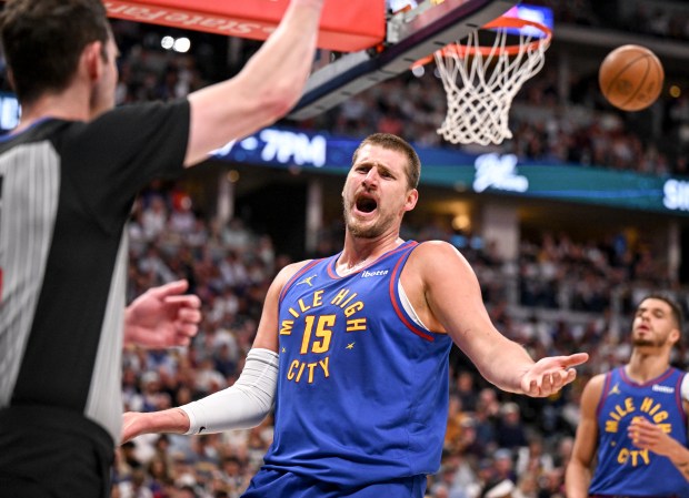 Nikola Jokic (15) of the Denver Nuggets argues a call...