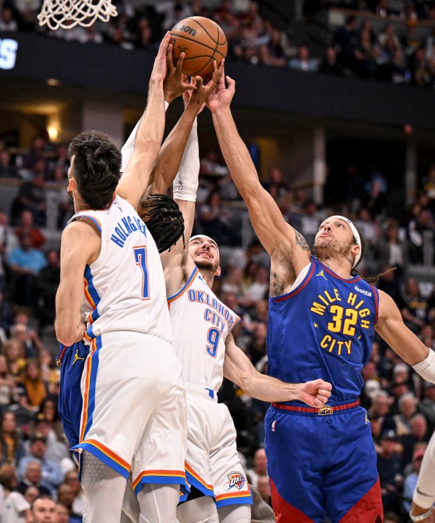 Peyton Watson (8) and Aaron Gordon (32) of the Denver...
