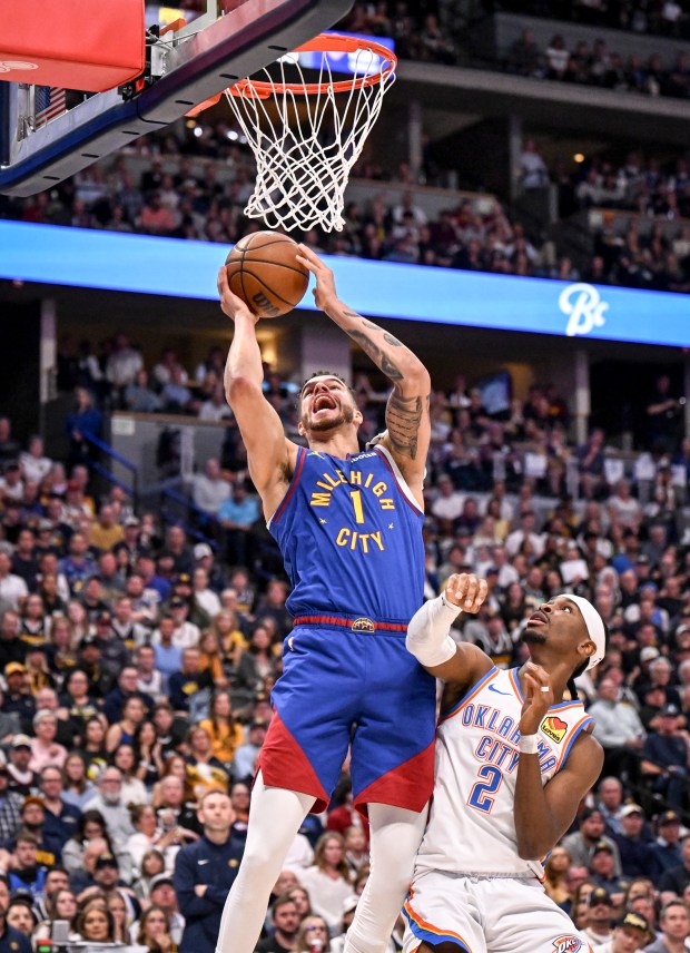 Michael Porter Jr. (1) of the Denver Nuggets misses a lob as Shai Gilgeous-Alexander (2) of the Oklahoma City Thunder defends during the third quarter of the Nuggets' 113-104 win at Ball Arena in Denver on Friday, May 9, 2025. (Photo by AAron Ontiveroz/The Denver Post)