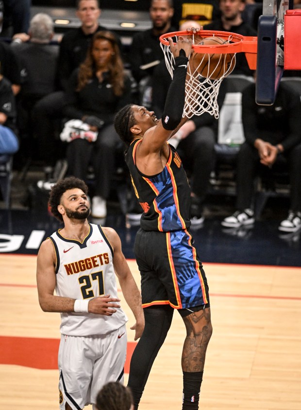 Jalen Williams (8) of the Oklahoma City Thunder dunks as...