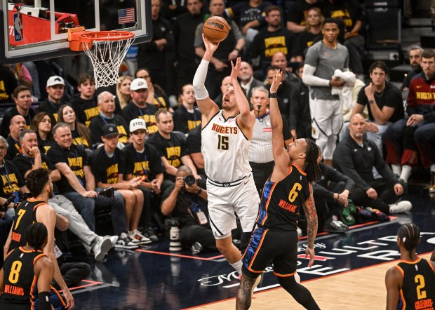 Nikola Jokic (15) of the Denver Nuggets misses as Jaylin...