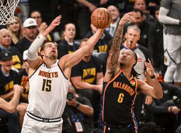 Nikola Jokic (15) of the Denver Nuggets and Jaylin Williams...