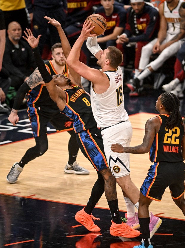 Nikola Jokic (15) of the Denver Nuggets shoots as Jalen...