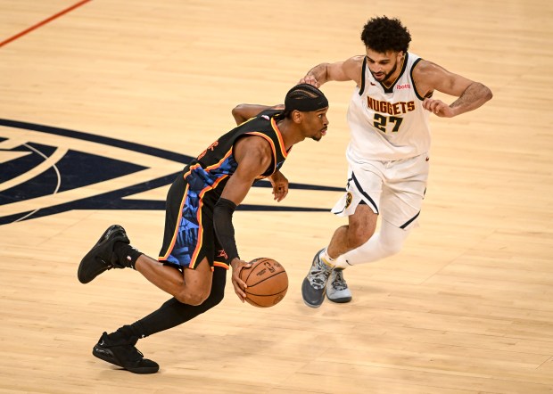 Shai Gilgeous-Alexander (2) of the Oklahoma City Thunder drives on...