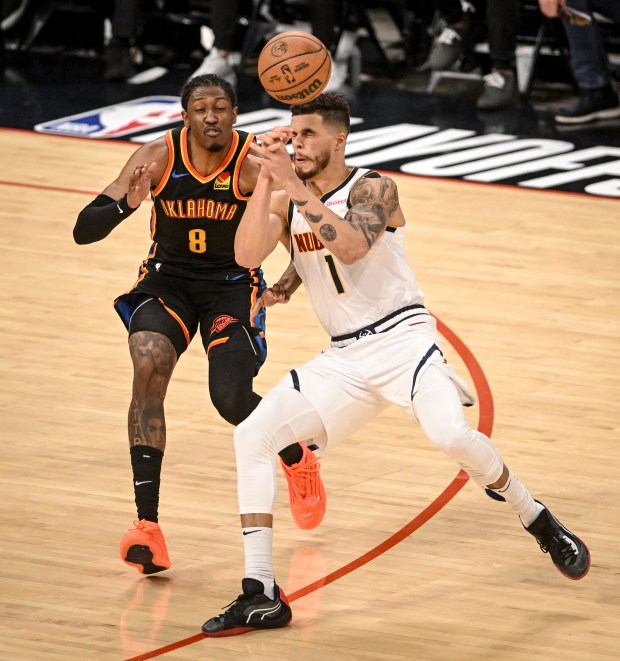 Michael Porter Jr. (1) of the Denver Nuggets loses a pass off of his head as Jalen Williams (8) of the Oklahoma City Thunder defends during the second quarter at Paycom Center in Oklahoma City, Oklahoma, on Wednesday, May 7, 2025. (Photo by AAron Ontiveroz/The Denver Post)