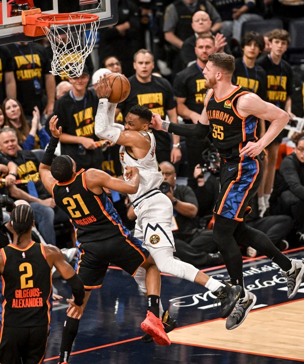 Aaron Wiggins (21) of the Oklahoma City Thunder fouls Russell...