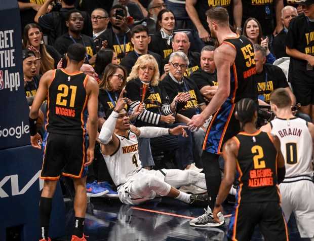 Russell Westbrook (4) of the Denver Nuggets exchanges words with...