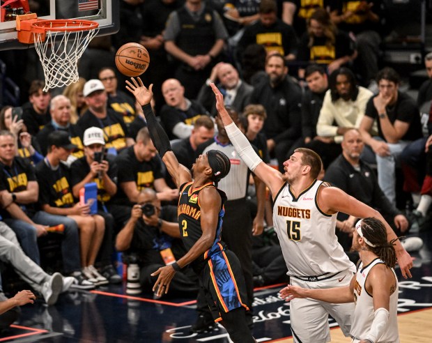 Shai Gilgeous-Alexander (2) of the Oklahoma City Thunder scores as...