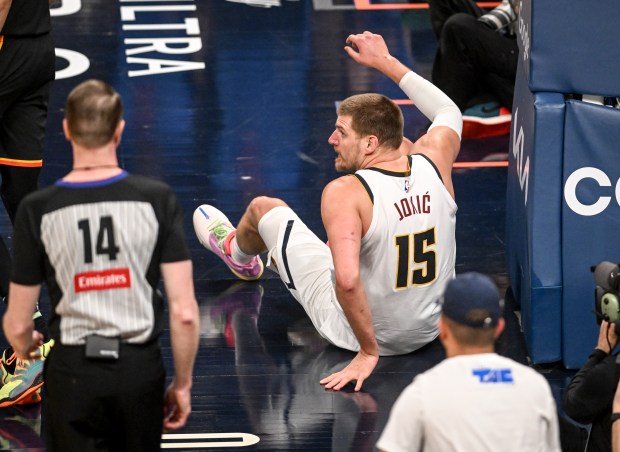 Nikola Jokic (15) of the Denver Nuggets sits on the...