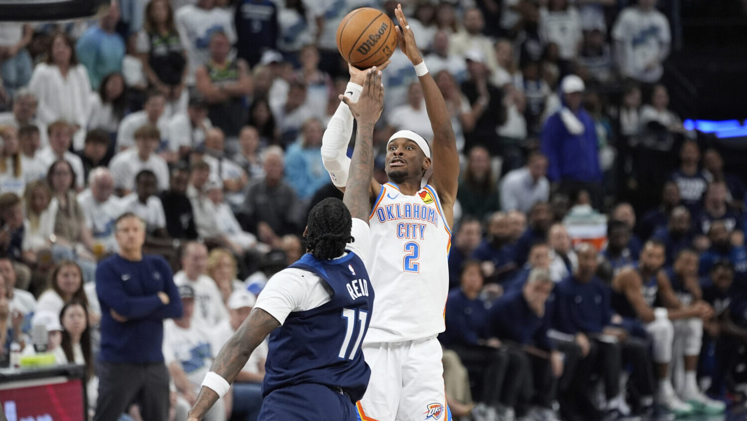 Oklahoma City Thunder guard Shai Gilgeous-Alexander (2) shoots against Minnesota Timberwolves cente...
