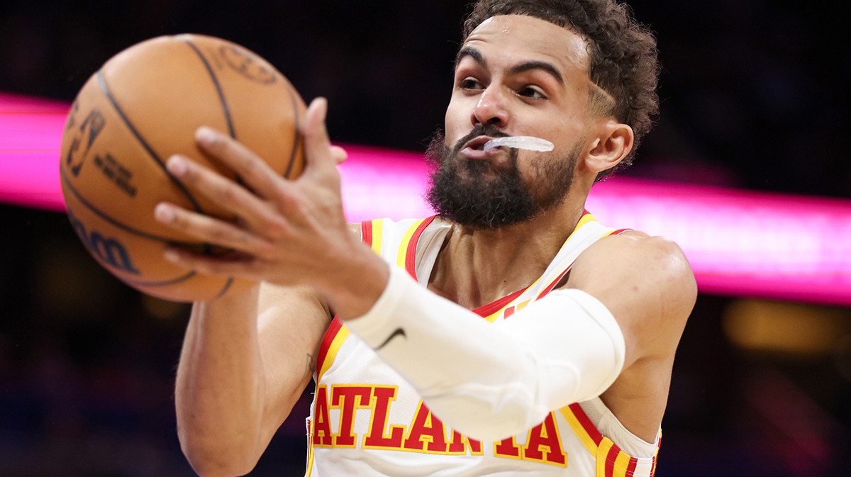 Atlanta Hawks guard Trae Young (11) rebounds the ball against the Orlando Magic in the fourth quarter at Kia Center.