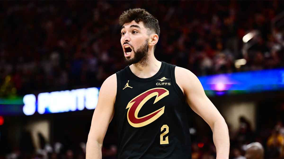 Cleveland Cavaliers guard Ty Jerome (2) celebrates after hitting a three point basket with guard Sam Merrill (5) and forward Evan Mobley (4) during the second half against the Toronto Raptors at Rocket Mortgage FieldHouse.