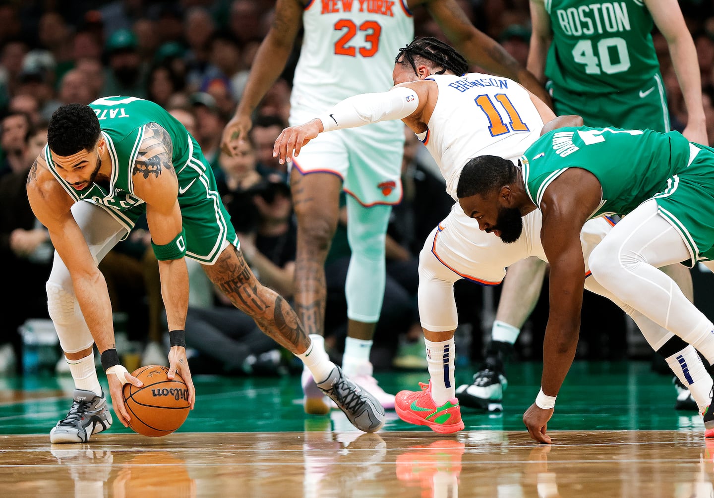 Boston Celtics forward Jayson Tatum (0) picks up a loose ball off a turnover by New York Knicks guard Jalen Brunson (11) during the first quarter.