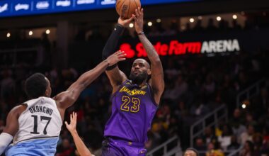 Dec 6, 2024; Atlanta, Georgia, USA; Los Angeles Lakers forward LeBron James (23) shoots over Atlanta Hawks forward Onyeka Okongwu (17) in the second quarter at State Farm Arena. Mandatory Credit: Brett Davis-Imagn Images