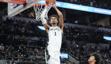 Spurs star Victor Wembanyama dunks against the Grizzlies during the 2024-25 NBA season.