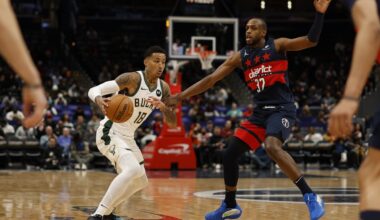 Milwaukee Bucks forward Kyle Kuzma (18) drives to the basket as Washington Wizards forward Khris Middleton (32) defends in the first half at Capital One Arena.