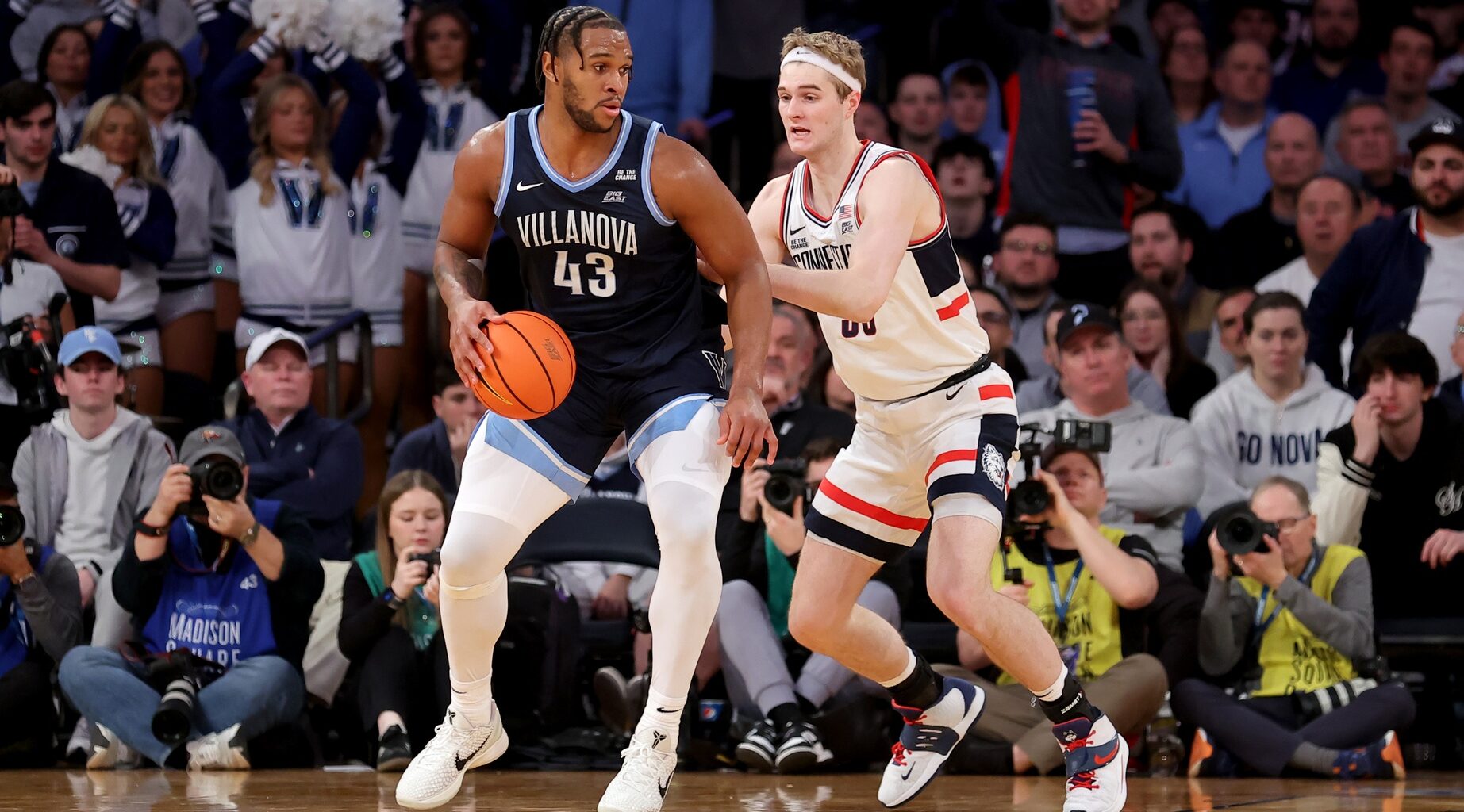 Mar 13, 2025; New York, NY, USA; Villanova Wildcats forward Eric Dixon (43) controls the ball against Connecticut Huskies forward Liam McNeeley (30) during the second half at Madison Square Garden. Mandatory Credit: Brad Penner-Imagn Images