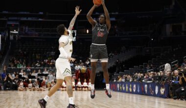 Saint Joseph's Hawks forward Rasheer Fleming (13) shoots the ball over Saint Joseph's Hawks forward Shawn Simmons II (10) in the first half at Capital One Arena.