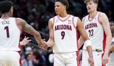 Mar 23, 2025; Seattle, WA, USA; Arizona Wildcats guard Caleb Love (1) high-fives forward Carter Bryant (9) during a stop in play against the Oregon Ducks in the second half at Climate Pledge Arena. Mandatory Credit: Stephen Brashear-Imagn Images