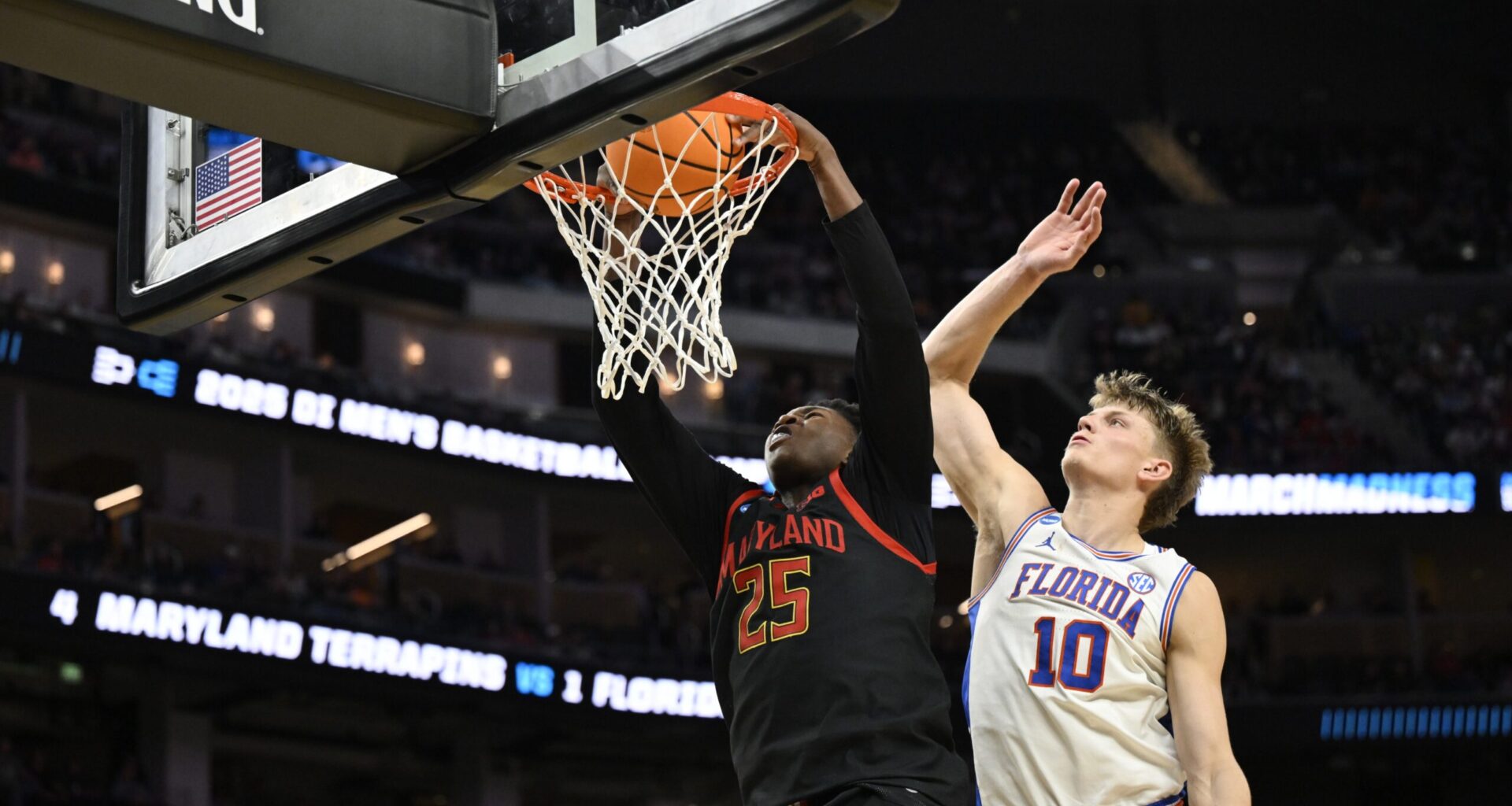 Mar 27, 2025; San Francisco, CA, USA; Maryland Terrapins center Derik Queen (25) dunks past Florida Gators forward Thomas Haugh (10) during the second half during a West Regional semifinal of the 2025 NCAA tournament at Chase Center. Mandatory Credit: Eakin Howard-Imagn Images