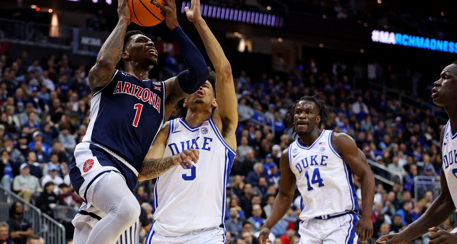 Mar 27, 2025; Newark, NJ, USA; Arizona Wildcats guard Caleb Love (1) shoots the ball against Duke Blue Devils guard Tyrese Proctor (5) during the second half during an East Regional semifinal of the 2025 NCAA tournament at Prudential Center. Mandatory Credit: Vincent Carchietta-Imagn Images