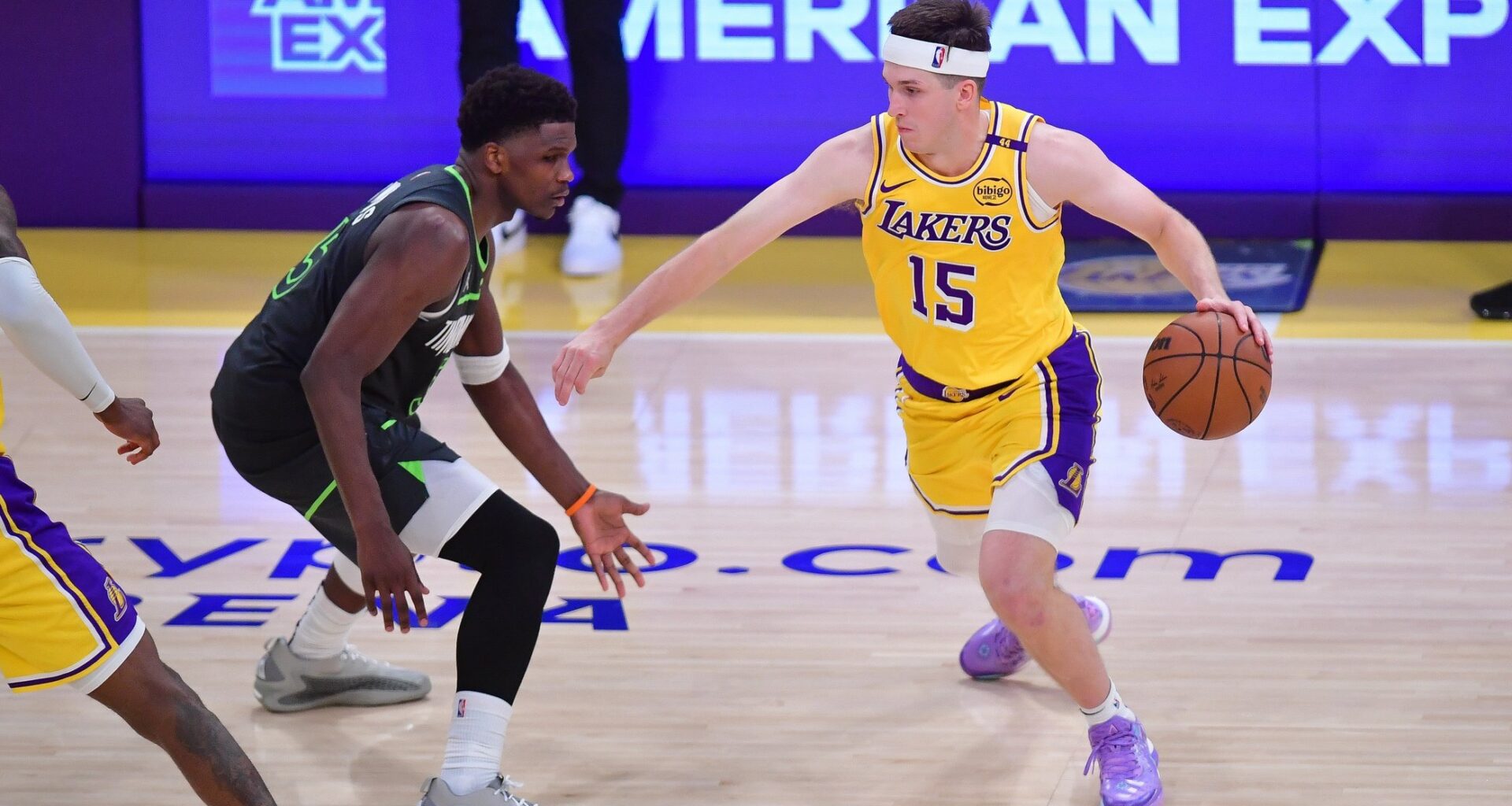 Apr 30, 2025; Los Angeles, California, USA; Los Angeles Lakers guard Austin Reaves (15) moves the ball against Minnesota Timberwolves guard Anthony Edwards (5) during the second half in game five of first round for the 2025 NBA Playoffs at Crypto.com Arena. Mandatory Credit: Gary A. Vasquez-Imagn Images