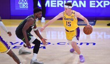 Apr 30, 2025; Los Angeles, California, USA; Los Angeles Lakers guard Austin Reaves (15) moves the ball against Minnesota Timberwolves guard Anthony Edwards (5) during the second half in game five of first round for the 2025 NBA Playoffs at Crypto.com Arena. Mandatory Credit: Gary A. Vasquez-Imagn Images