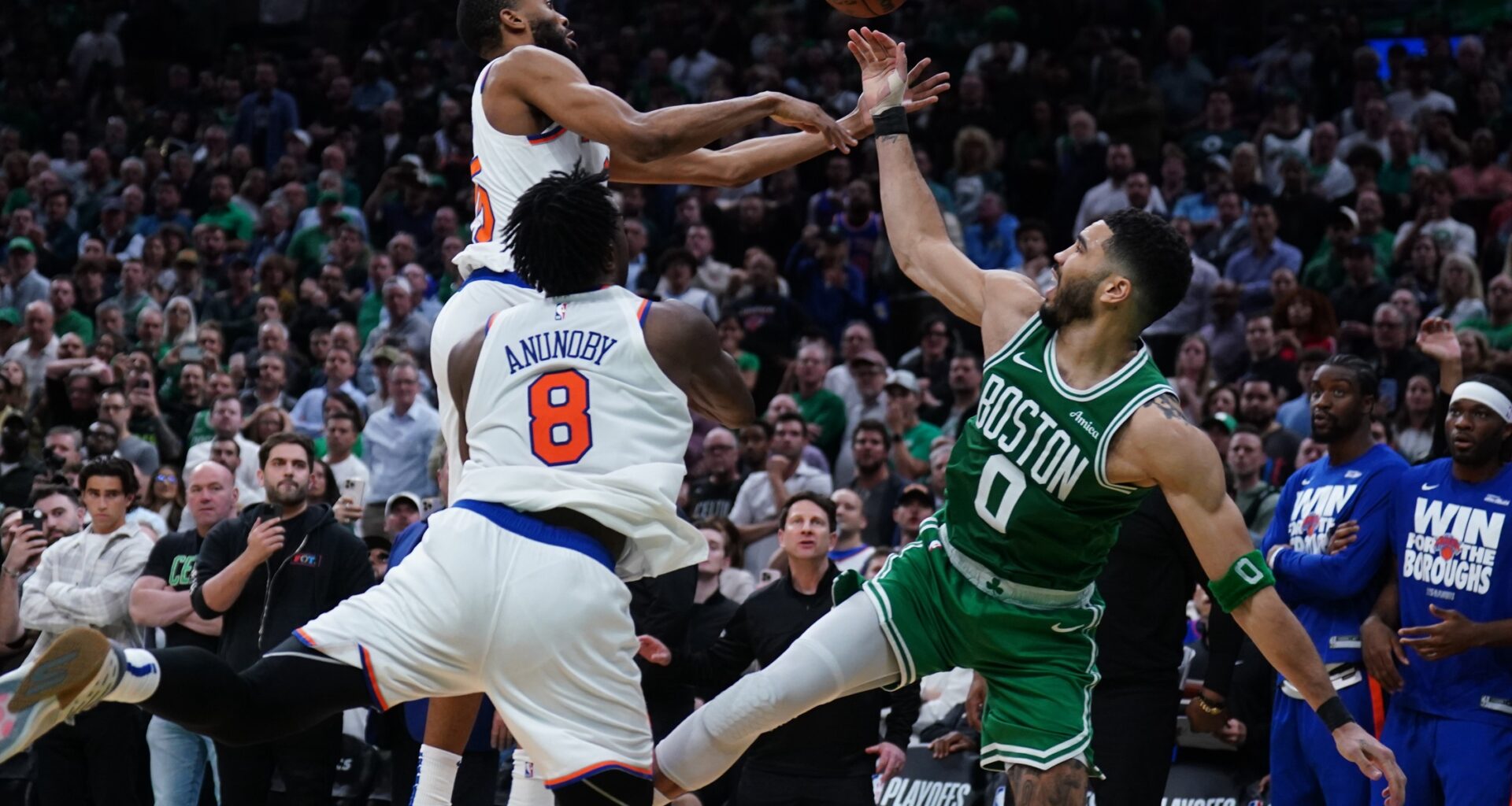 Celtics star Jayson Tatum loses the ball against the Knicks during the 2024-25 NBA Playoffs.