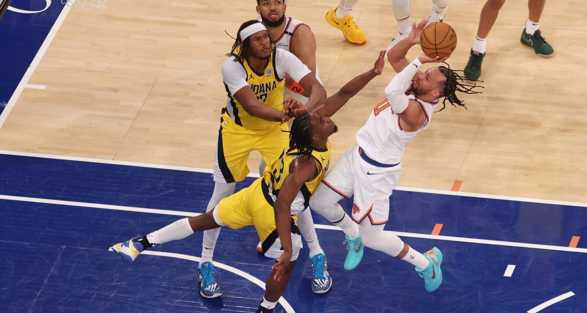 New York Knicks guard Jalen Brunson (11) shoots against Indiana Pacers forward Aaron Nesmith (23) in the fourth quarter during game two of the eastern conference finals for the 2025 NBA Playoffs at Madison Square Garden.