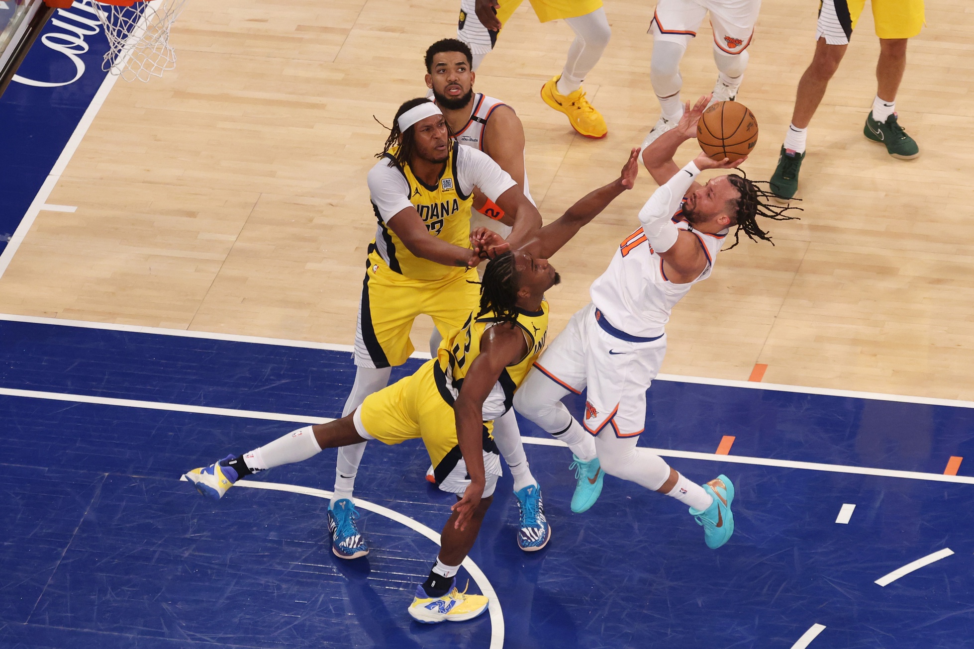 New York Knicks guard Jalen Brunson (11) shoots against Indiana Pacers forward Aaron Nesmith (23) in the fourth quarter during game two of the eastern conference finals for the 2025 NBA Playoffs at Madison Square Garden.