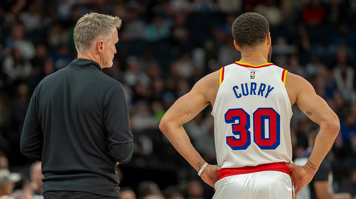 Golden State Warriors head coach Steve Kerr and guard Stephen Curry (30) look on against the Minnesota Timberwolves in the second half at Target Center.