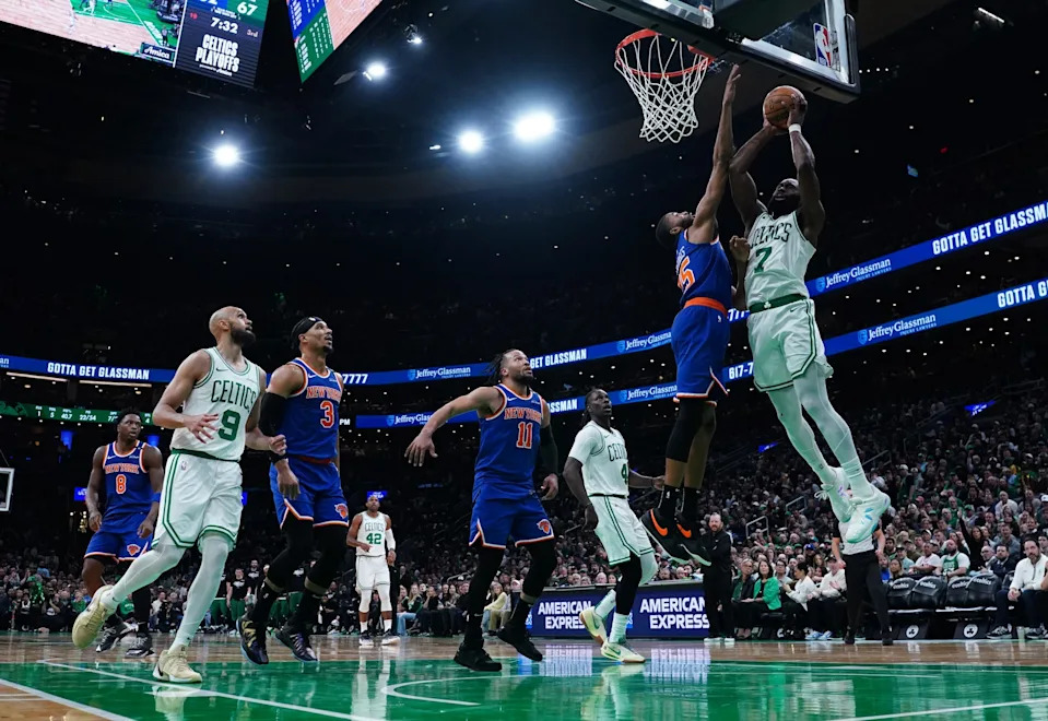 May 5, 2025; Boston, Massachusetts, USA; Boston Celtics guard Jaylen Brown (7) works the ball against New York Knicks forward Mikal Bridges (25) in the third quarter during game one of the second round for the 2025 NBA Playoffs at TD Garden. Mandatory Credit: David Butler II-Imagn Images