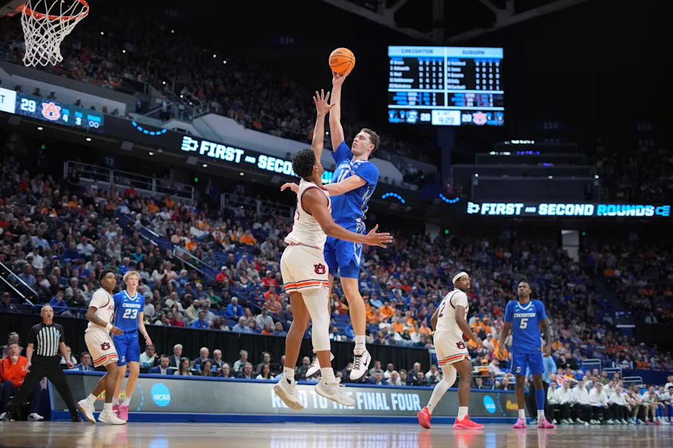 Mar 22, 2025; Lexington, KY, USA; Creighton Bluejays center Ryan Kalkbrenner (11) shoots the ball against Auburn Tigers center Dylan Cardwell (44) during the first half in the second round to the NCAA Tournament at Rupp Arena. Mandatory Credit: Aaron Doster-Imagn Images
