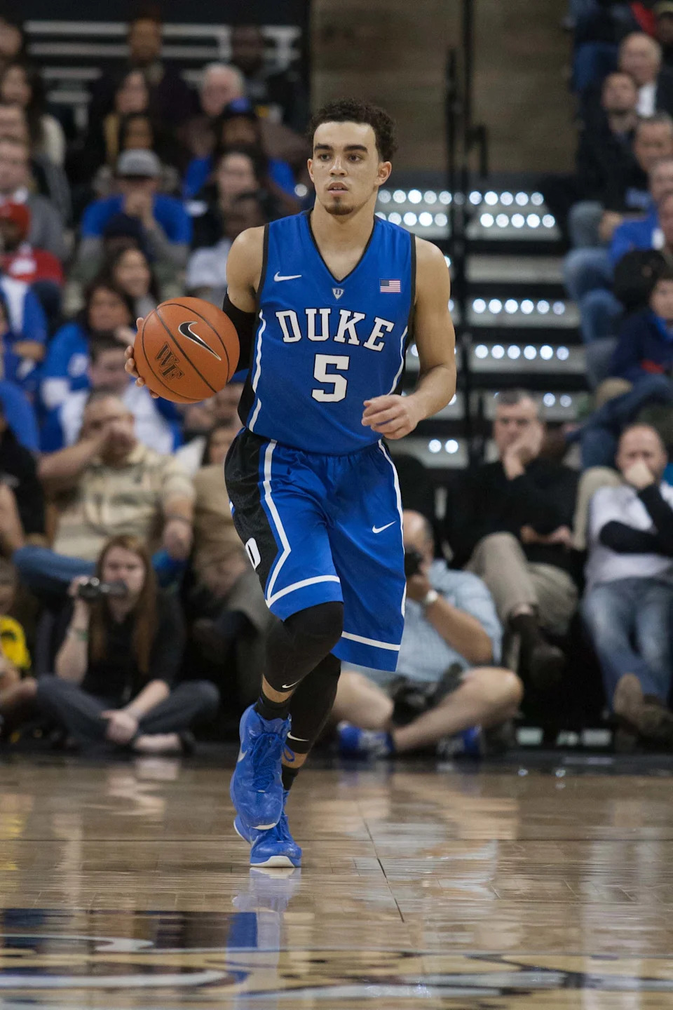 Duke Blue Devils guard Tyus Jones (5) brings the ball up the court during the second half against the Wake Forest Demon Deacons.