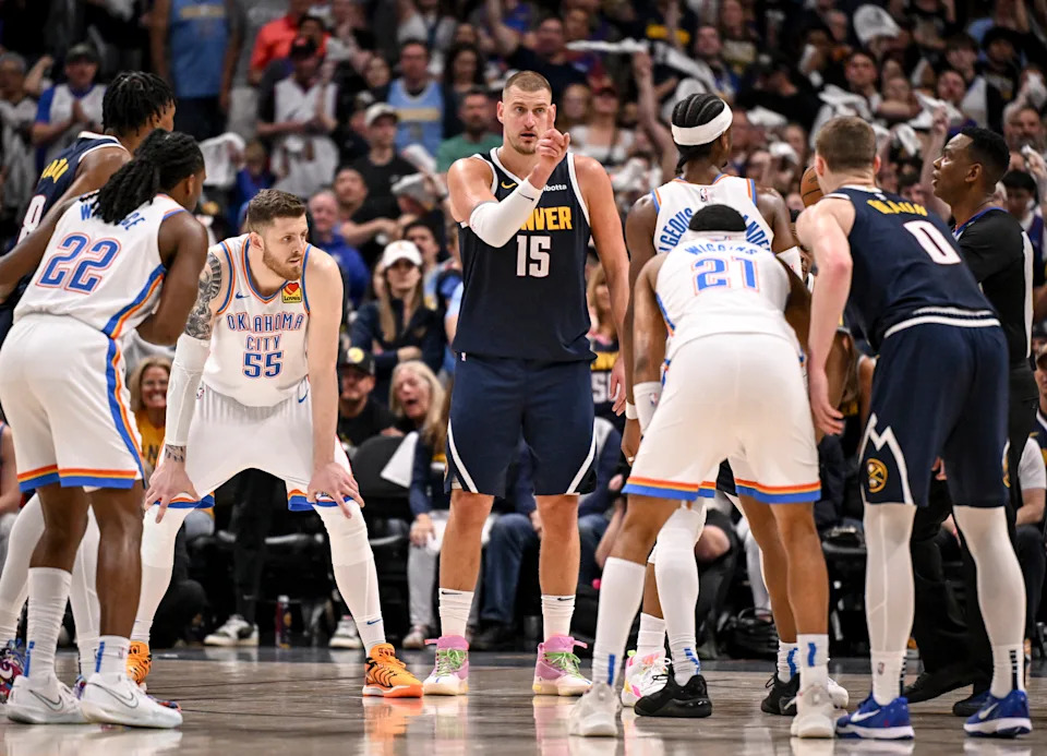 DENVER, CO - MAY 11: Nikola Jokic (15) of the Denver Nuggets coaches Christian Braun (0) before a jump ball between Shai Gilgeous-Alexander (2) and Russell Westbrook (4) during the third quarter at Ball Arena in Denver, Colorado on Sunday, May 11, 2025. (Photo by AAron Ontiveroz/The Denver Post)