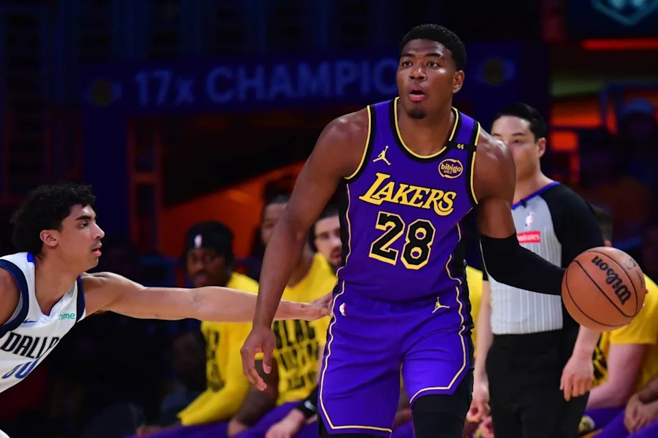Los Angeles Lakers forward Rui Hachimura (28) dribbles the ball on Dallas Mavericks guard Max Christie (00) during the first quarter at Crypto.com Arena.Mandatory Credit: Gary A. Vasquez-Imagn Images