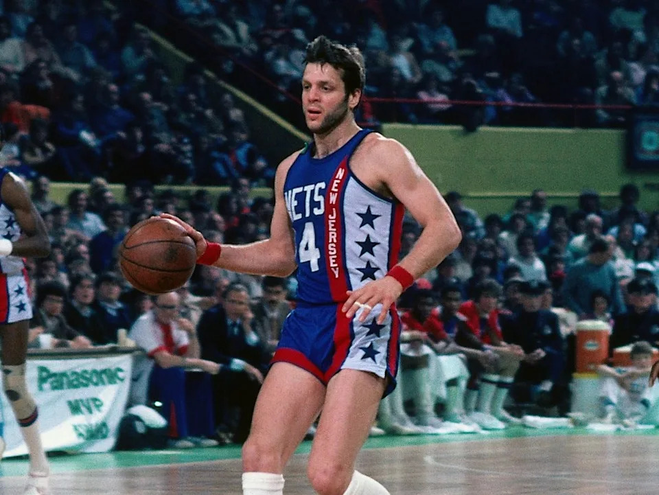 BOSTON - 1981: Mike Newlin #14 of the New Jersey Nets moves the ball up the court against the Boston Celtics during a game played in 1981 at the Boston Garden in Boston, Massachusetts. NOTE TO USER: User expressly acknowledges and agrees that, by downloading and or using this photograph, User is consenting to the terms and conditions of the Getty Images License Agreement. Mandatory Copyright Notice: Copyright 1981 NBAE (Photo by Dick Raphael/NBAE via Getty Images)