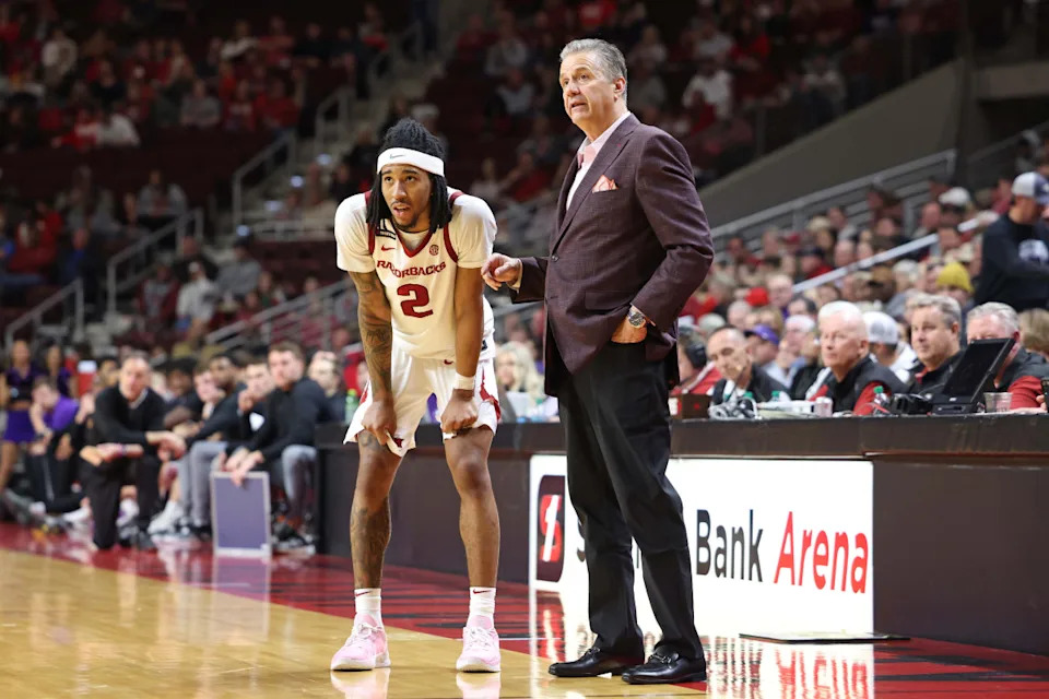 Arkansas Razorbacks guard Boogie Fland and head coach John Calipari© Nelson Chenault-Imagn Images
