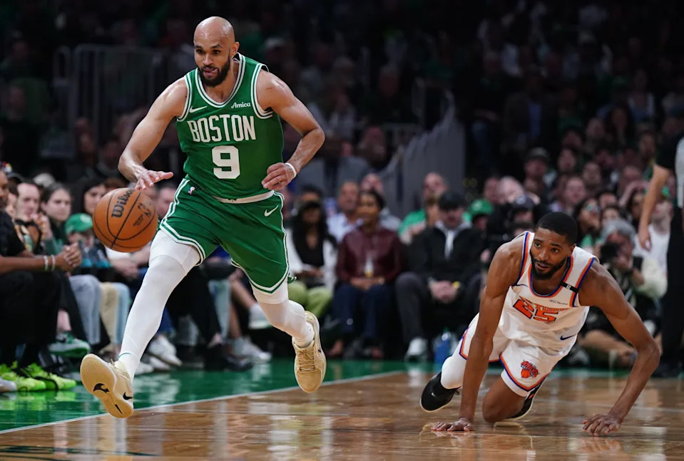 May 7, 2025; Boston, Massachusetts, USA; Boston Celtics guard Derrick White (9) and New York Knicks forward Mikal Bridges (25) work for the ball in the second quarter during game two of the second round for the 2025 NBA Playoffs at TD Garden. Mandatory Credit: David Butler II-Imagn Images