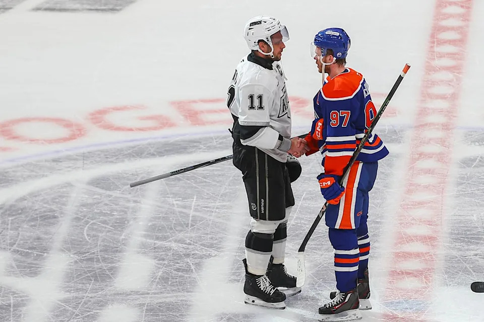 Kings captain Anze Kopitar, left, shakes hands with Edmonton Oilers captain Connor McDavid.