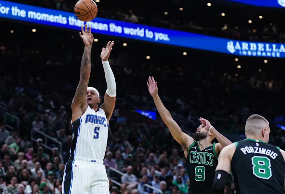 Orlando Magic forward Paolo Banchero shoots the ball against Boston Celtics guard Derrick White in the second quarter during game five of first round for the 2025 NBA Playoffs at TD Garden.David Butler II-Imagn Images