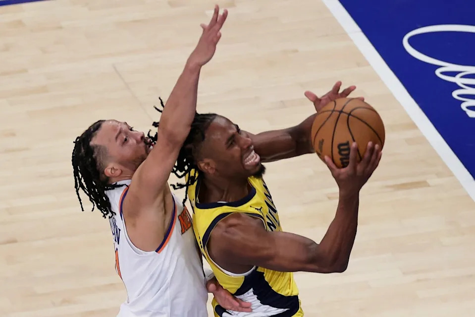 Pacers forward Aaron Nesmith (23) puts up a shot against New York Knicks guard Jalen Brunson (11) during the third quarter of Game 2 of the NBA basketball Eastern Conference final, Friday, May 23, 2025, AP